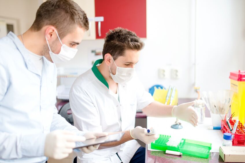 Pharmacists and scientist carrying out experiments in laboratory